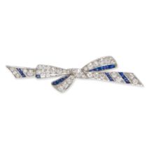 AN ART DECO PLATINUM, SAPPHIRE, AND DIAMOND BOW BROOCH