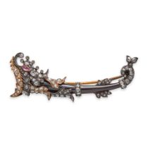 BOUCHERON: AN ANTIQUE GARNET AND DIAMOND DOLPHIN BROOCH, FRANCE