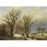 Johann Bernard Klombeck (Belgian, 1815-1893) Dutch winter scene with figures an woodland path an...