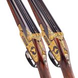 A very fine pair of K. C. Hunt engraved and gold-decorated 12-bore self-opening sidelock ejector...