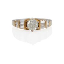 A 14K GOLD AND DIAMOND RING