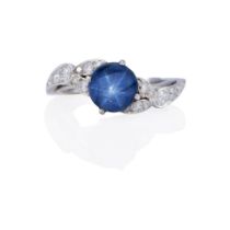 A PLATINUM, STAR SAPPHIRE AND DIAMOND RING