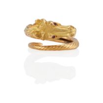 AN 18K GOLD AND RUBY EQUESTRIAN RING