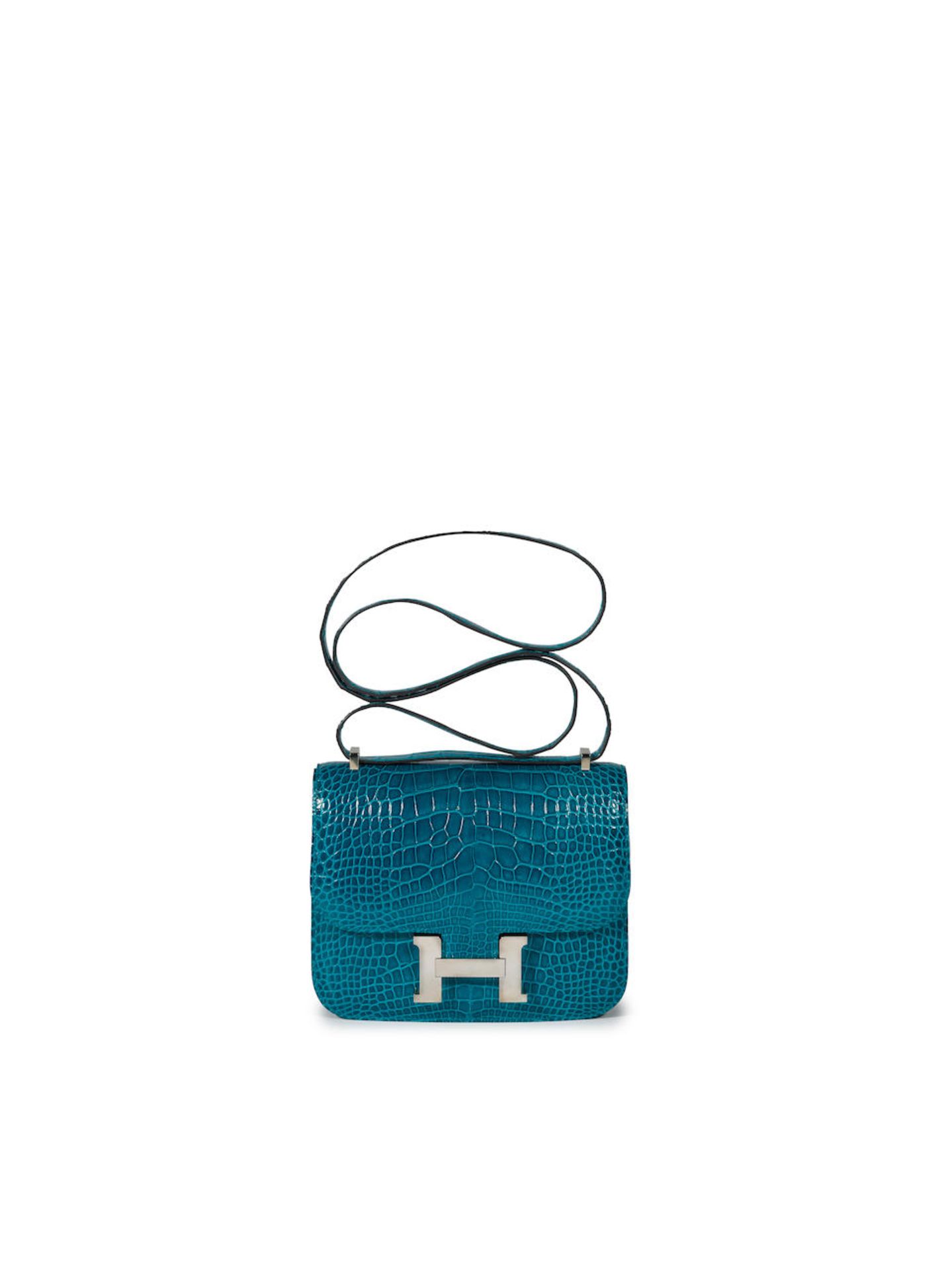 HERMÈS: BLEU IZMIR SHINY ALLIGATOR MINI CONSTANCE 18 WITH PALLADIUM HARDWARE (Includes orig...