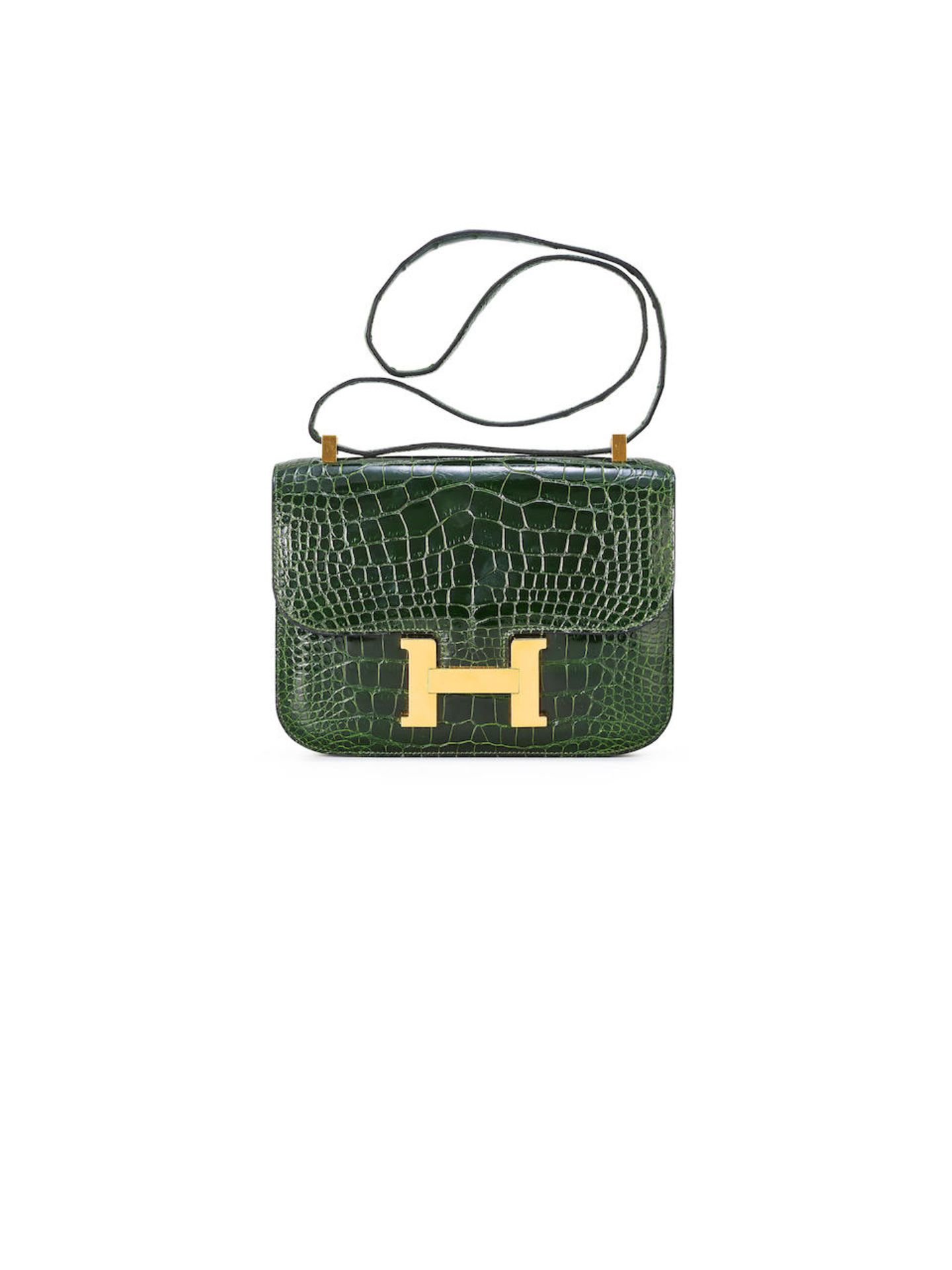 HERMÈS: VERT EMERAUDE SHINY ALLIGATOR CONSTANCE 24 WITH GOLD HARDWARE (Includes original du...