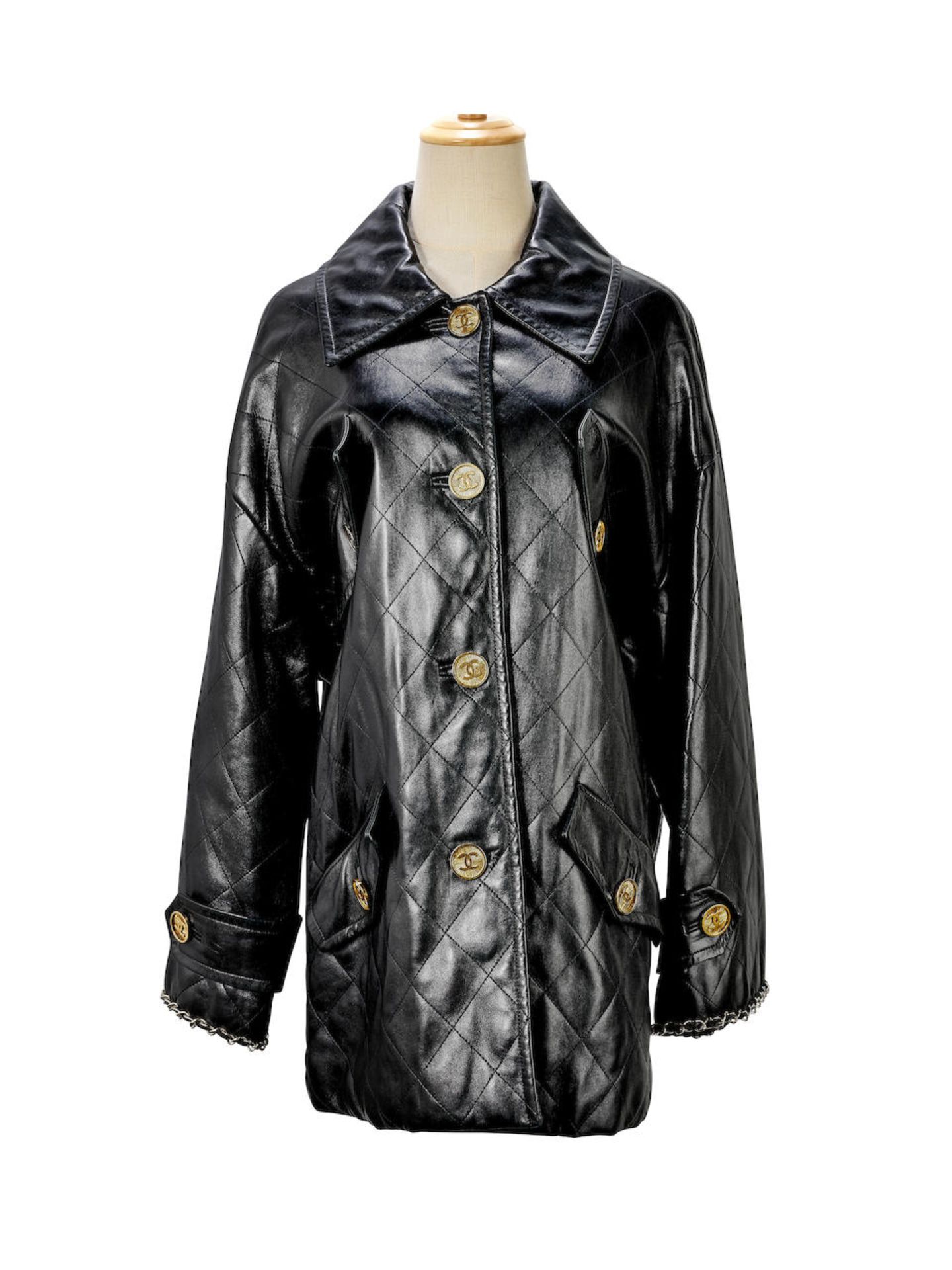 CHANEL: BLACK QUILTED LEATHER JACKET WITH CC BUTTONS (Includes original garment bag)