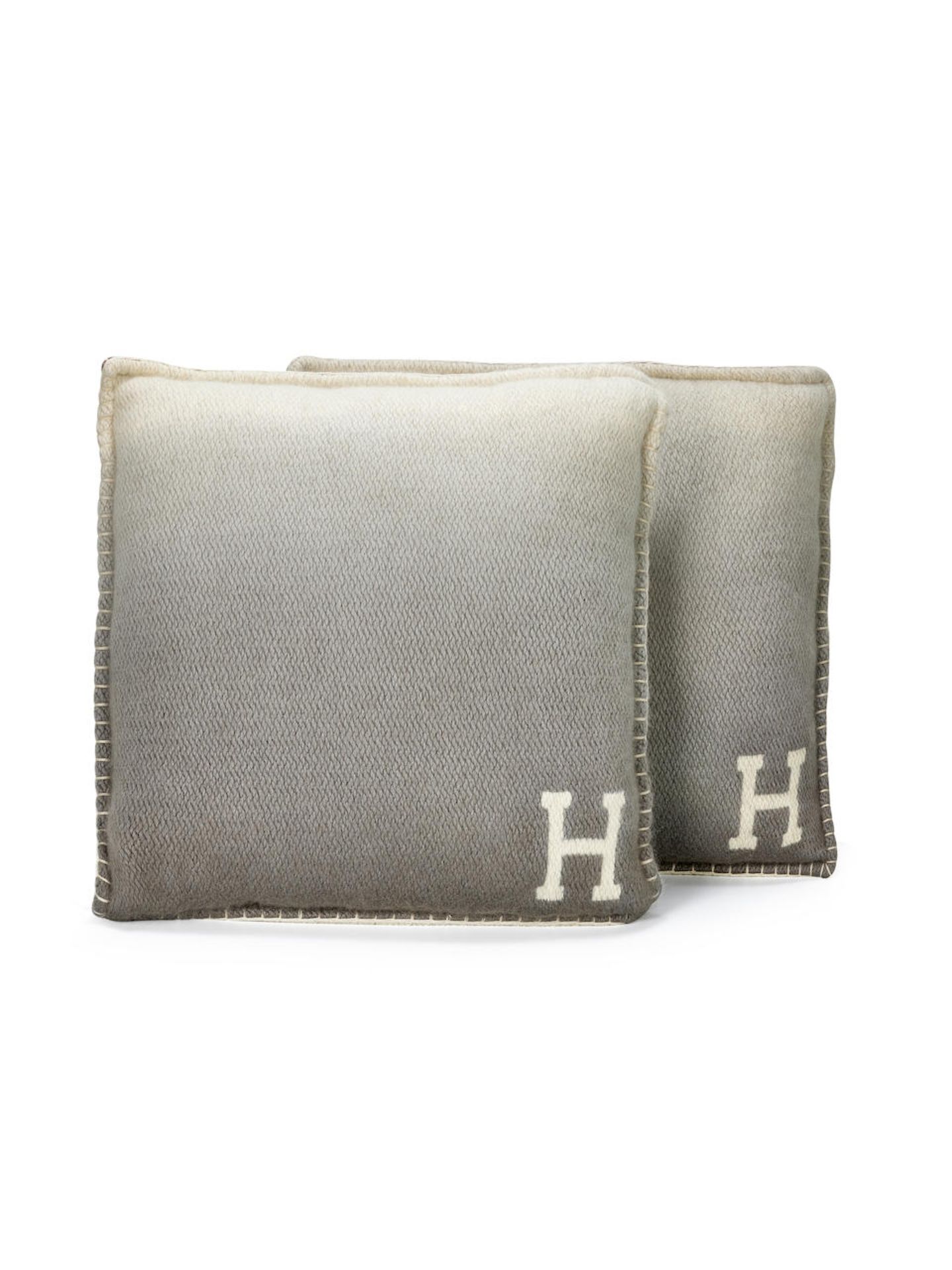 HERMÈS: A SET OF TWO NATURAL/GREY/OMBRE BROWN YACK'N'DYE 100% WOOL PILLOWs (Includes origi...