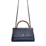 CHANEL: NAVY CAVIAR AND RED LIZARD COCO HANDLE WITH SILVER TONED HARDWARE (Includes serial stick...