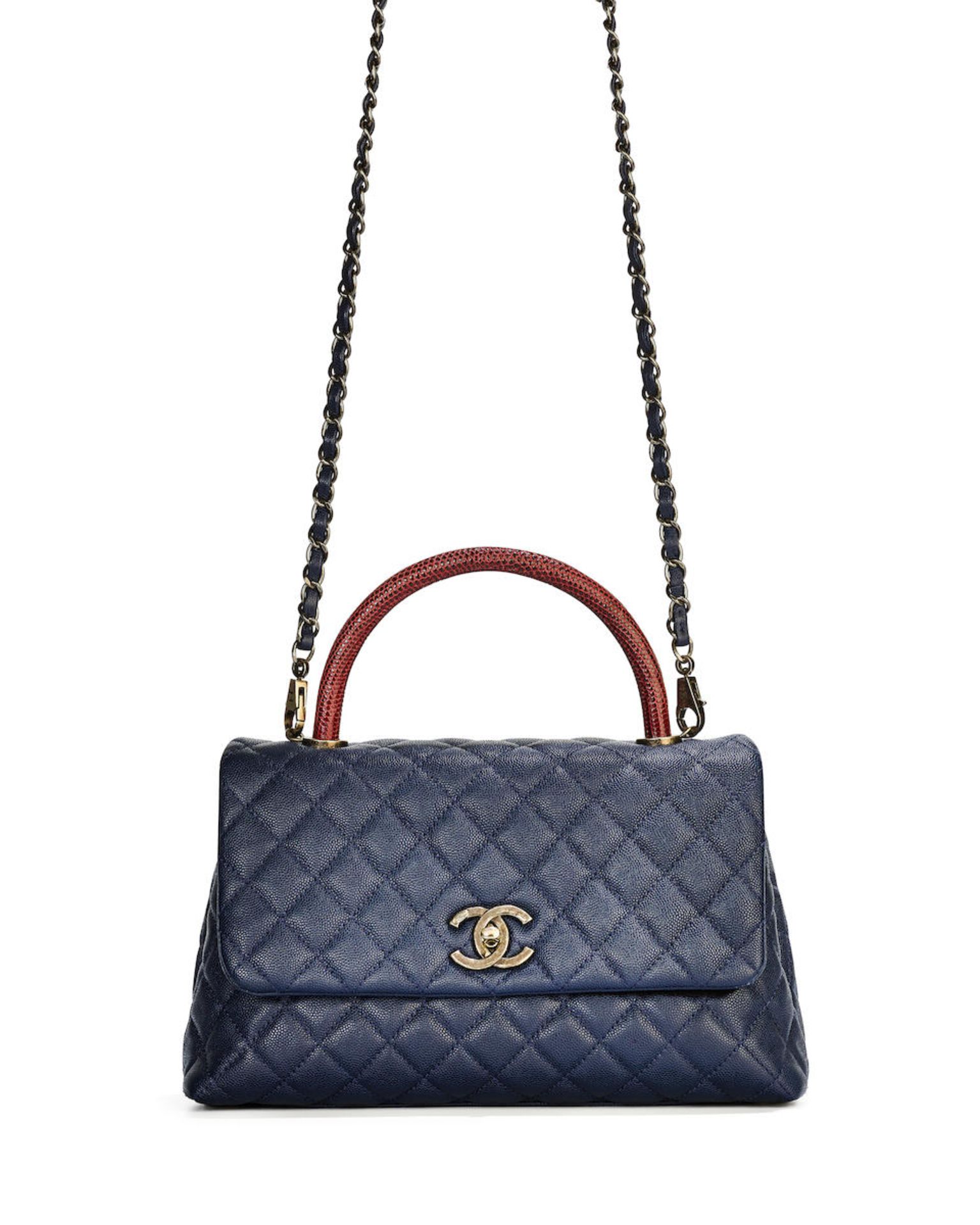 CHANEL: NAVY CAVIAR AND RED LIZARD COCO HANDLE WITH SILVER TONED HARDWARE (Includes serial stick...