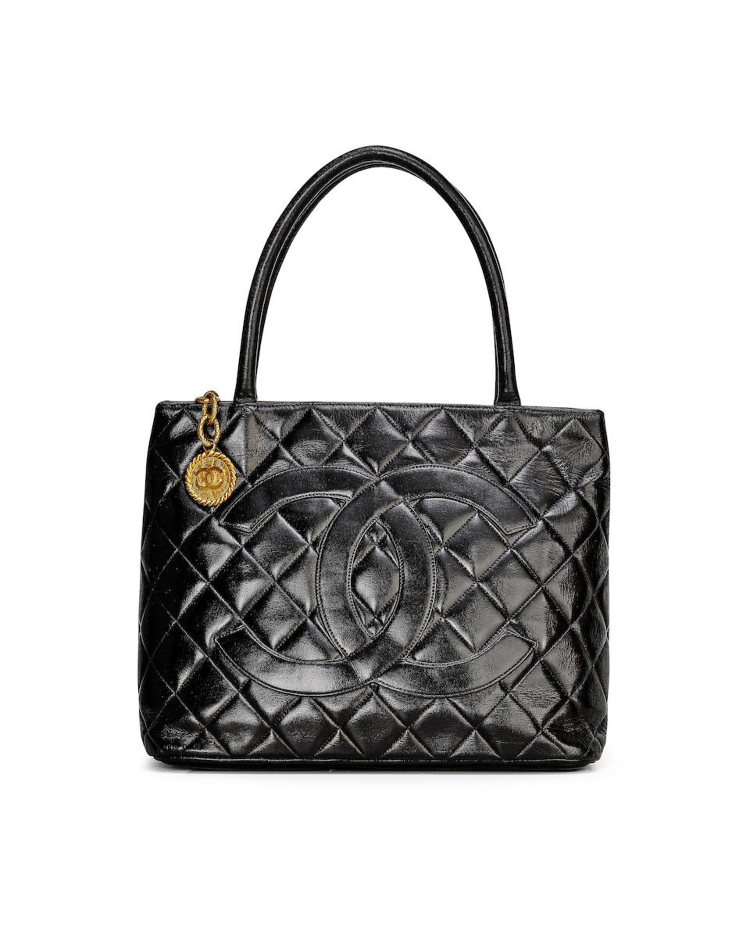 CHANEL: BLACK LAMBSKIN MEDALLION QUILTED TOTE BAG WITH GOLD TONED HARDWARE (Includes serial stic...
