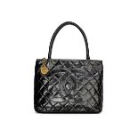 CHANEL: BLACK LAMBSKIN MEDALLION QUILTED TOTE BAG WITH GOLD TONED HARDWARE (Includes serial stic...