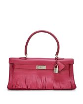 HERMÈS: A LIMITED EDITION WINE RUBI RED CLEMENCE FRINGE SHOULDER KELLY 42 WITH PALLADIUM HA...