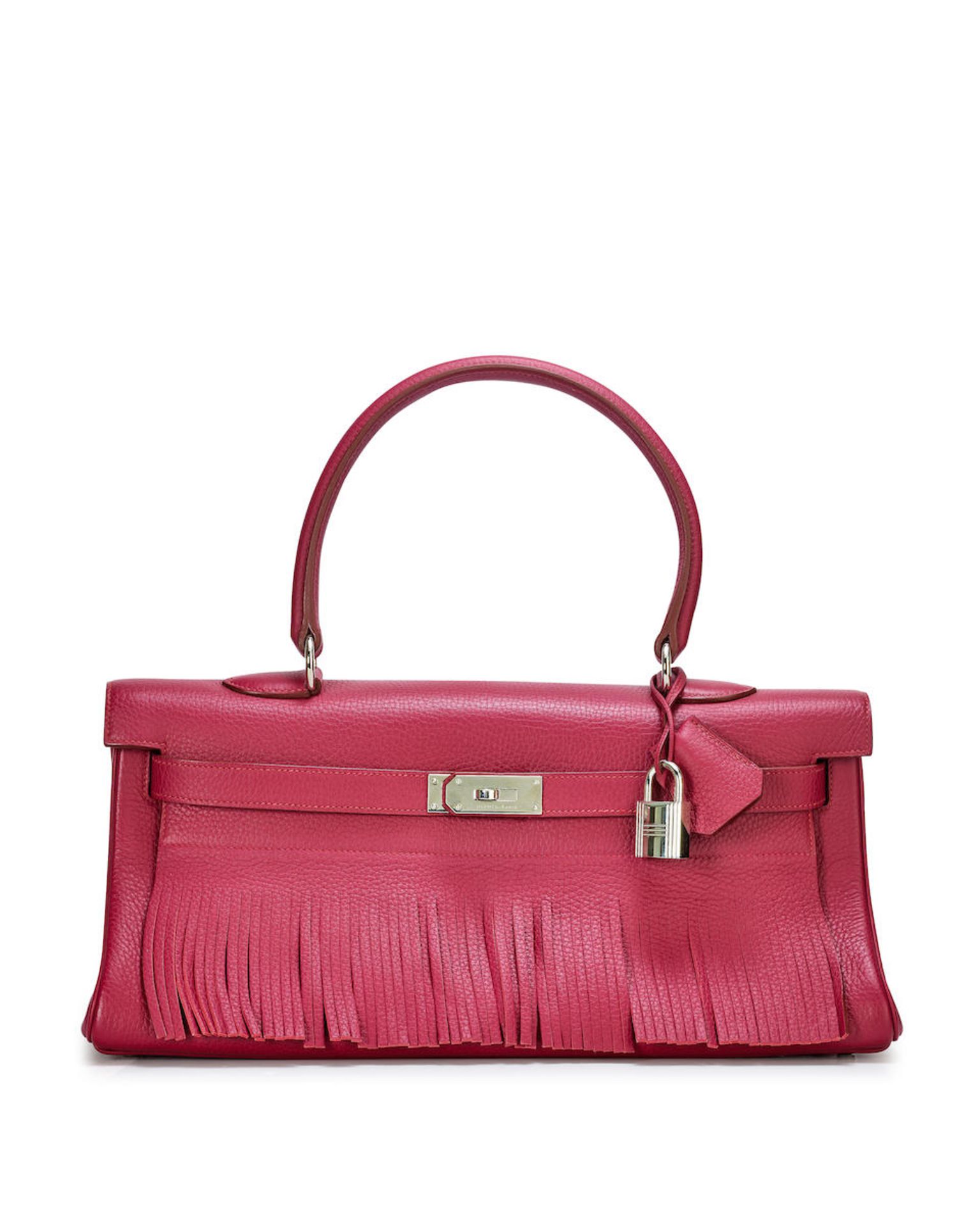 HERMÈS: A LIMITED EDITION WINE RUBI RED CLEMENCE FRINGE SHOULDER KELLY 42 WITH PALLADIUM HA...