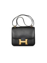 HERMÈS: BLACK SWIFT CONSTANCE 24 WITH GOLD HARDWARE (Includes booklet, felt protector, orig...