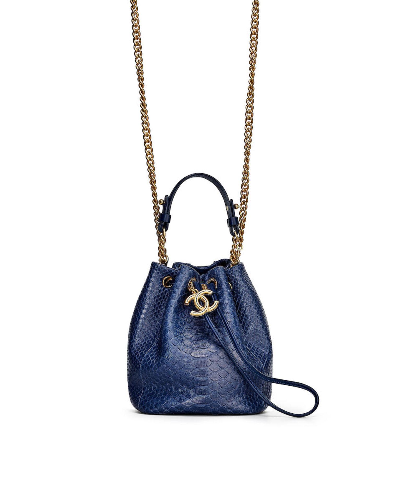 CHANEL: BLUE PYTHON BUCKET BAG WITH POLISHED GOLD TONED HARDWARE (Includes serial sticker, auth...