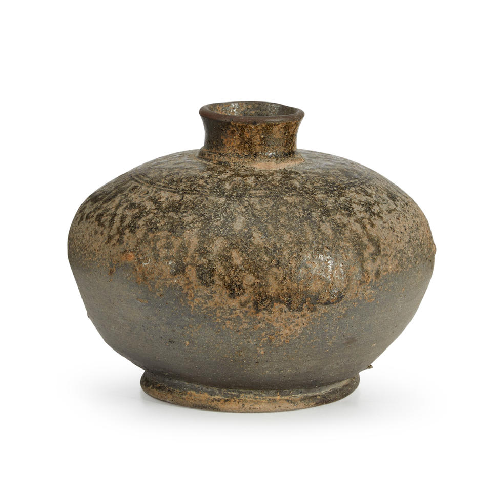 AN ASH-GLAZED STONEWARE BOTTLE-FORM BURIAL JAR