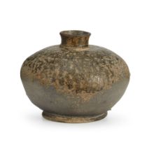 AN ASH-GLAZED STONEWARE BOTTLE-FORM BURIAL JAR