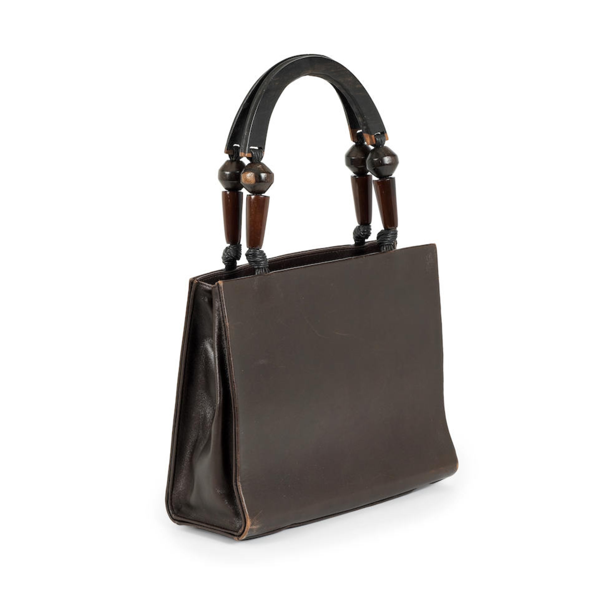 Yves SAINT LAURENT. Sac de jour en cuir marron.