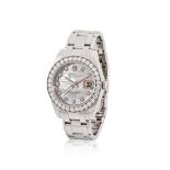Rolex. A fine lady's 18K white gold automatic calendar bracelet watch with diamond set bezel and...