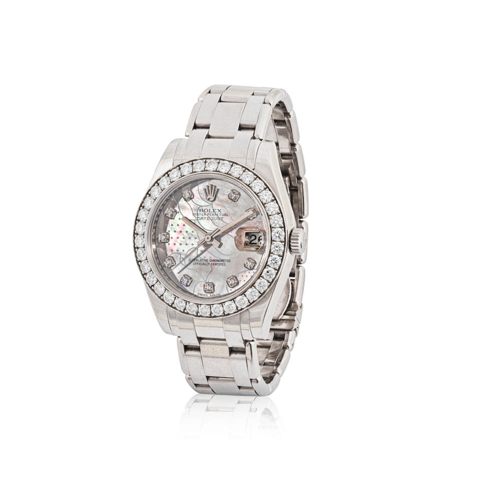 Rolex. A fine lady's 18K white gold automatic calendar bracelet watch with diamond set bezel and...
