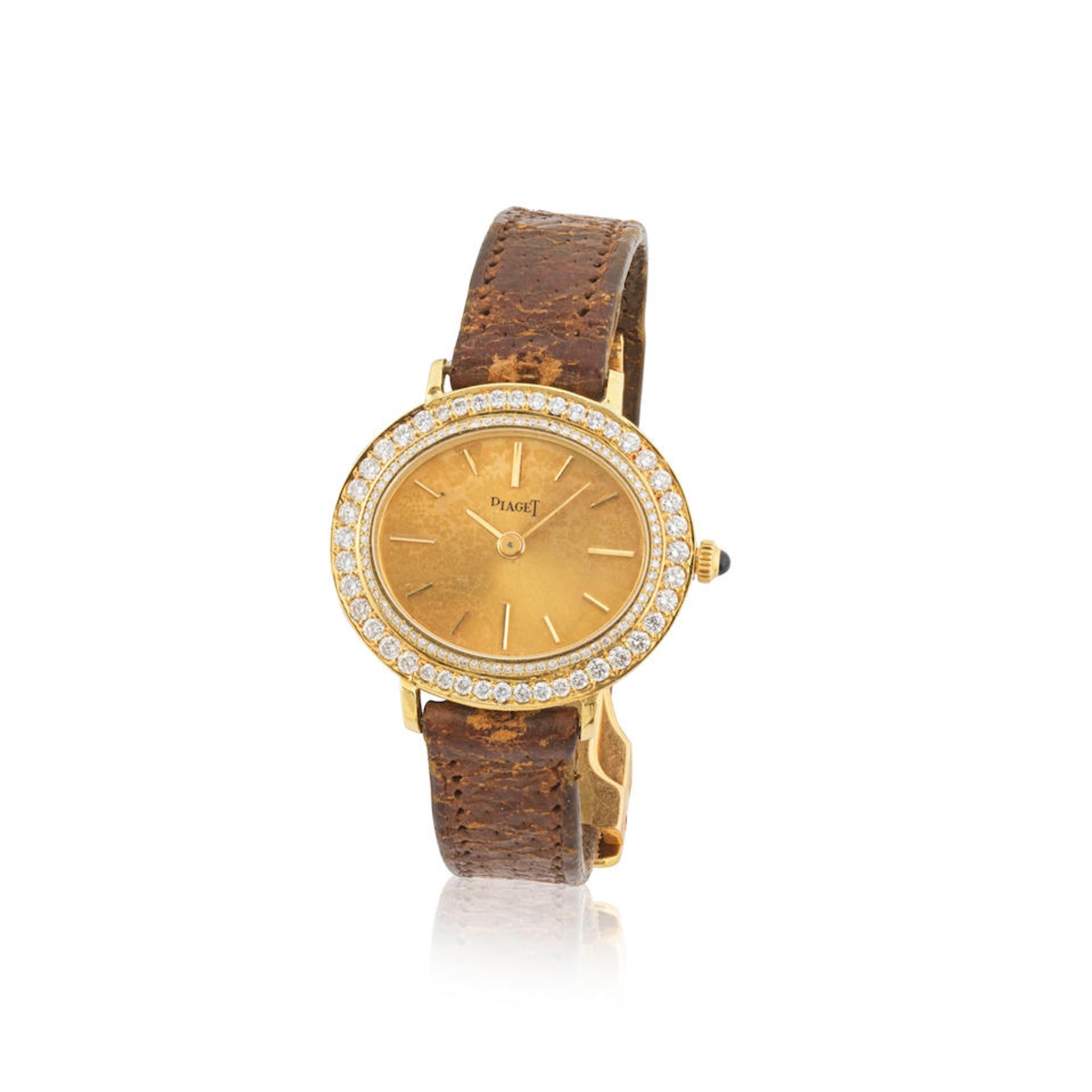 Piaget. A lady's 18K gold manual wind wristwatch with diamond set bezel Piaget. Montre bracelet ...