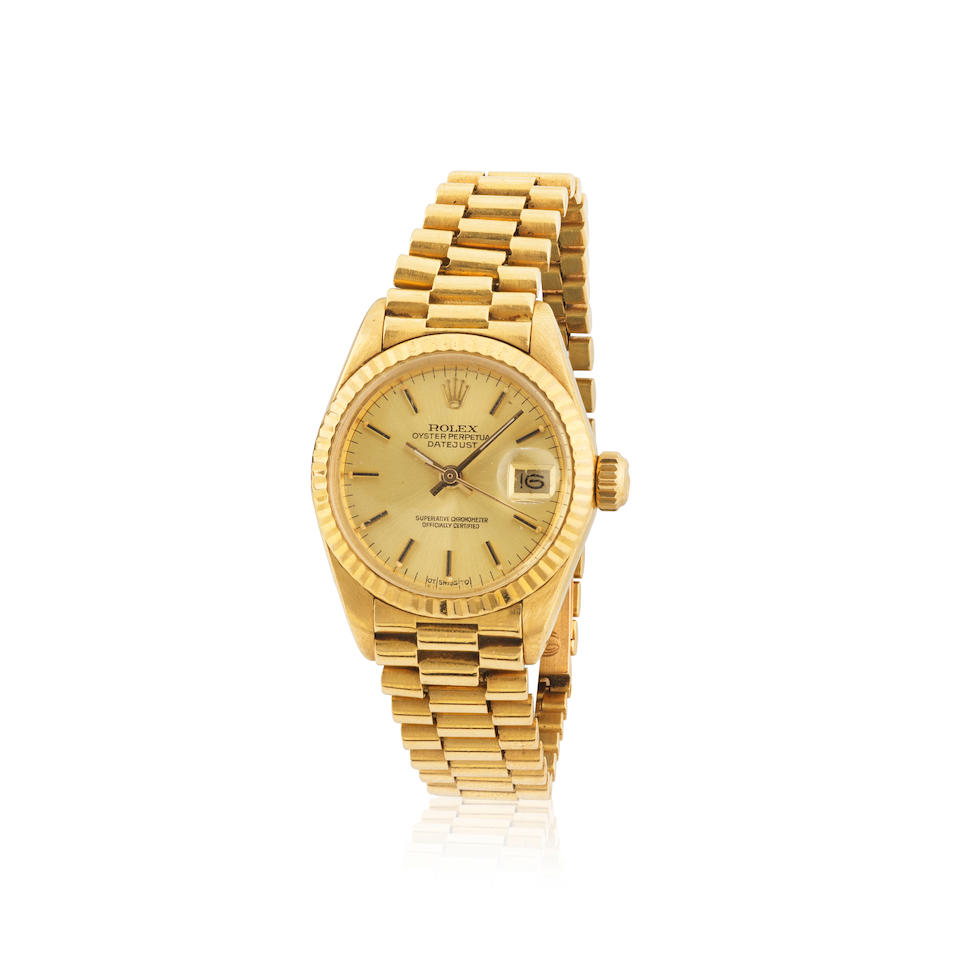 Rolex. A fine lady's 18K gold automatic calendar bracelet watch with sigma dial Rolex. Belle mon...
