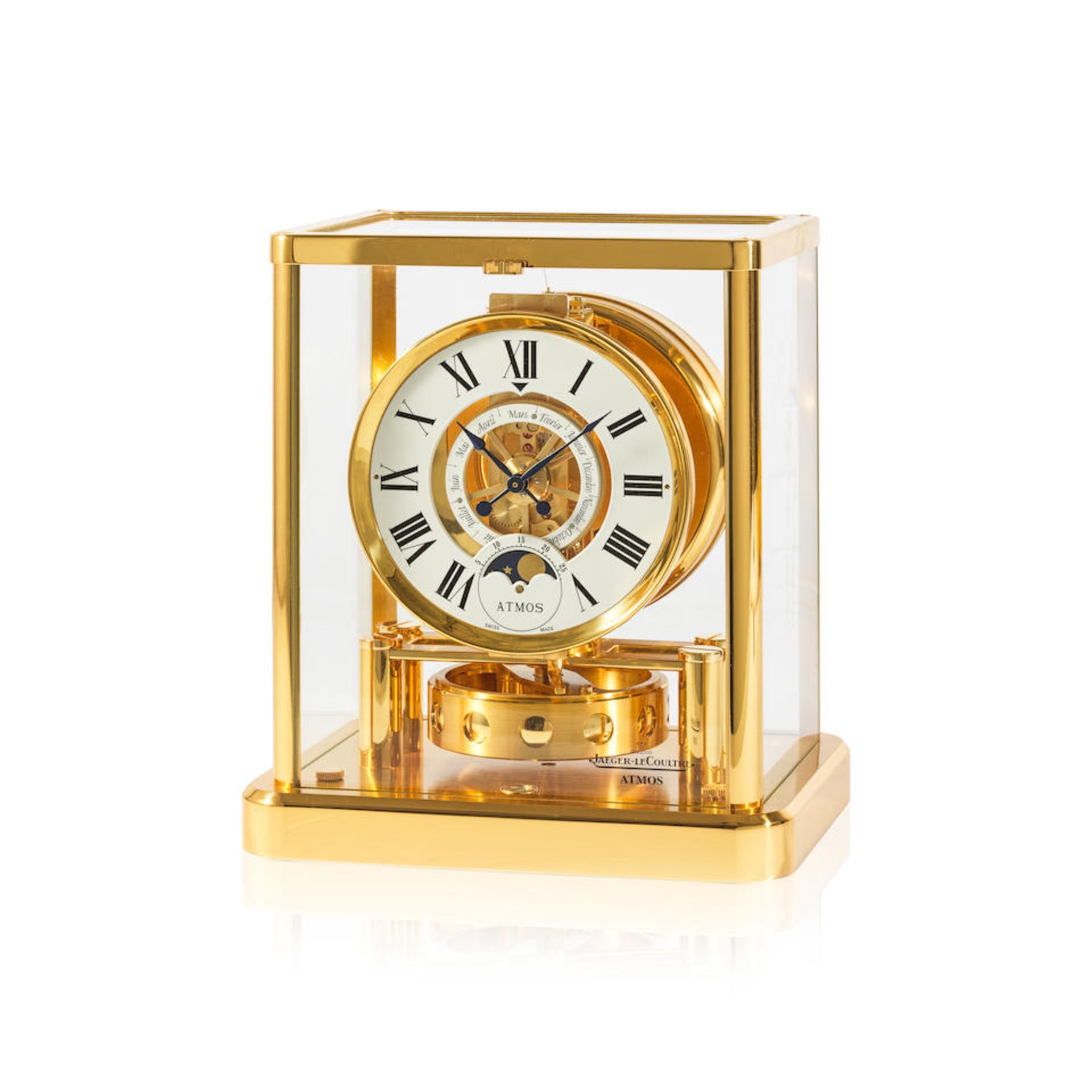 Jaeger-LeCoultre. A fine gilt brass and glass enclosed perpetual wind Atmos clock with month cal...