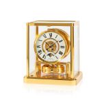 Jaeger-LeCoultre. A fine gilt brass and glass enclosed perpetual wind Atmos clock with month cal...
