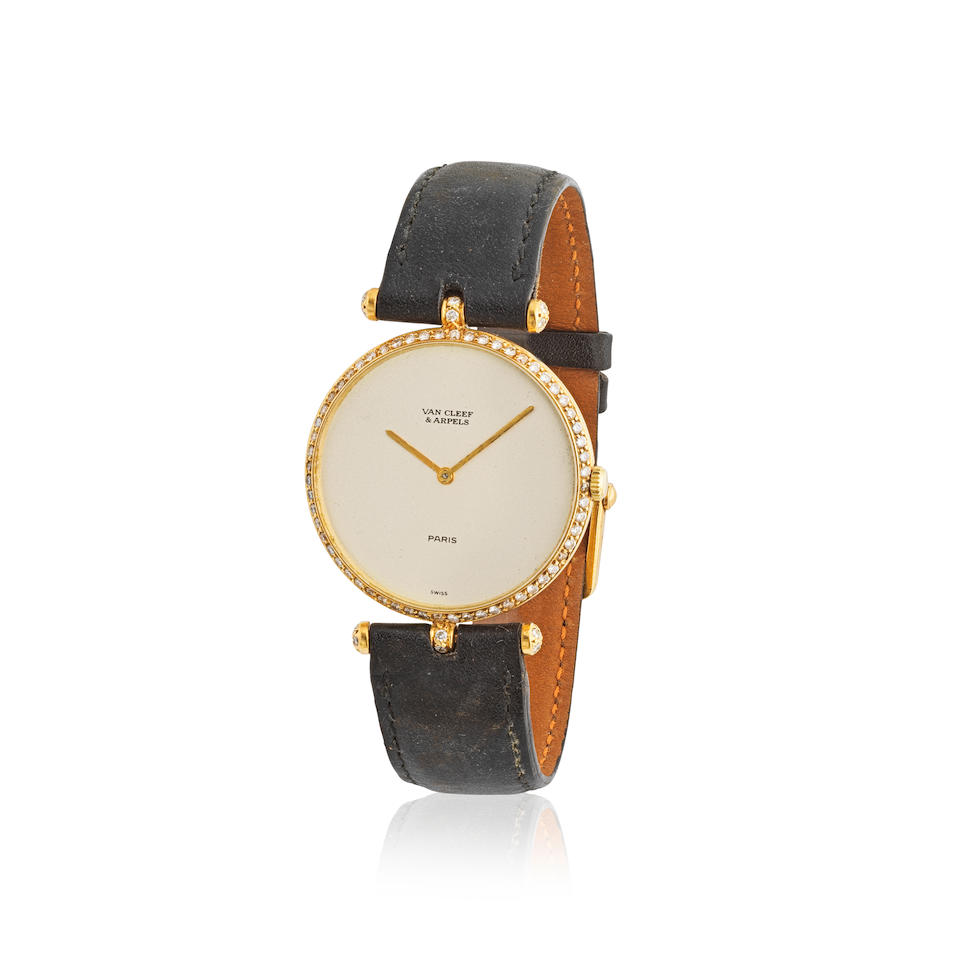 Van Cleef & Arpels. A lady's 18K gold manual wind wristwatch with diamond set bezel Van Cleef & ...