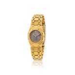 Audemars Piguet. A lady's 18K gold quartz calendar bracelet watch Audemars Piguet. Montre bracel...