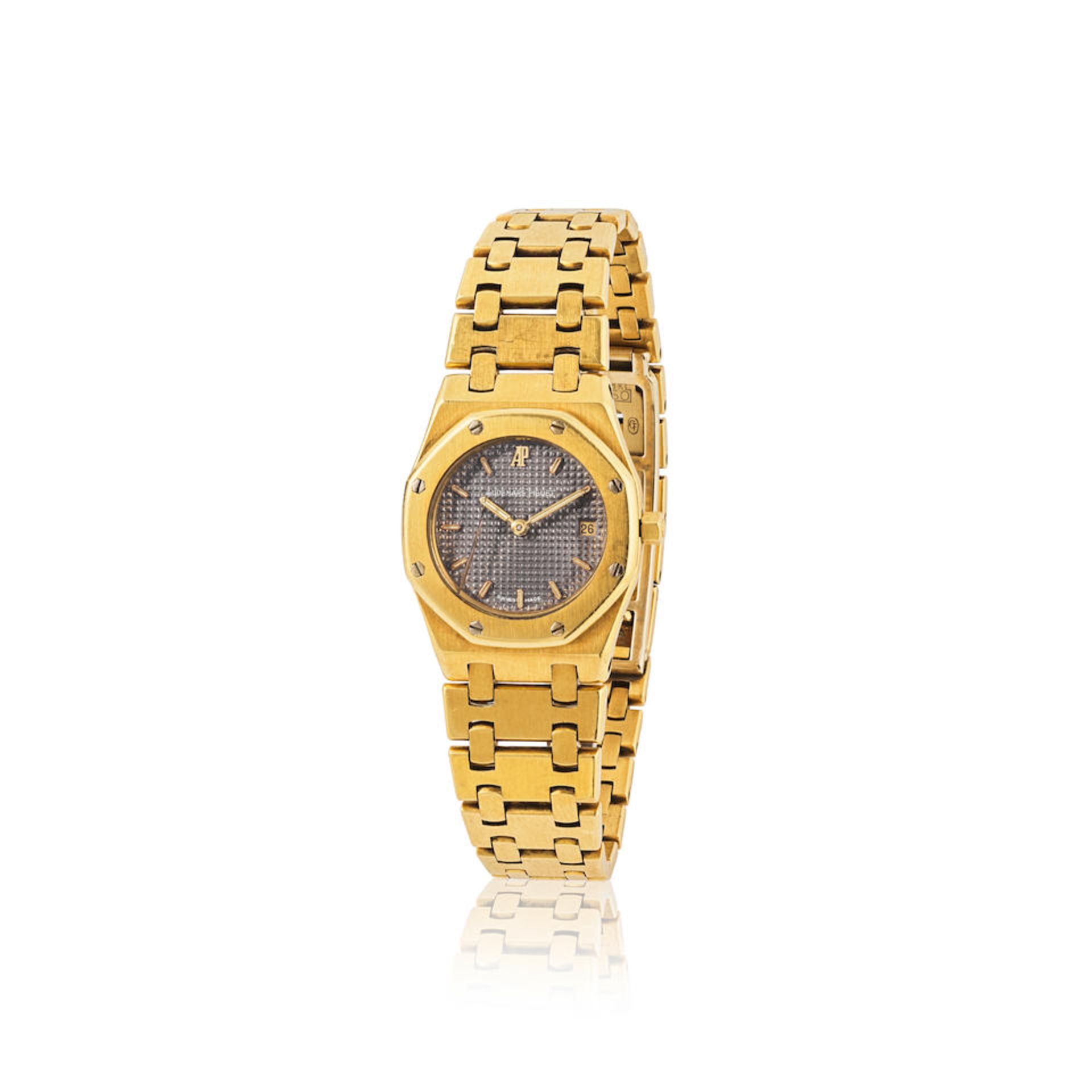 Audemars Piguet. A lady's 18K gold quartz calendar bracelet watch Audemars Piguet. Montre bracel...