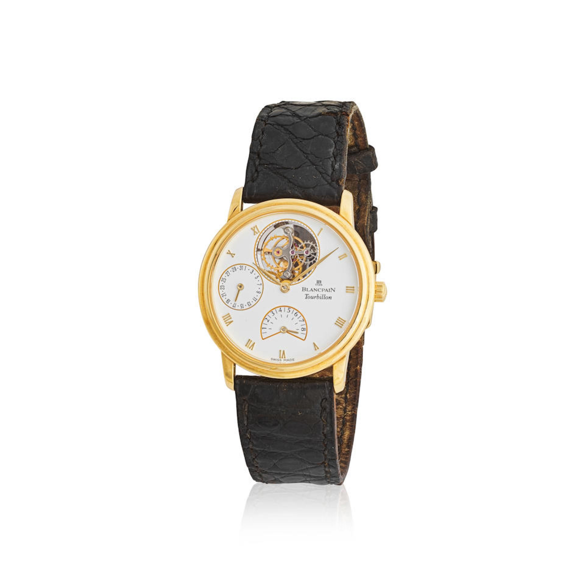 Blancpain. A fine and rare 18K gold manual wind tourbillon calendar wristwatch with 8 days power...