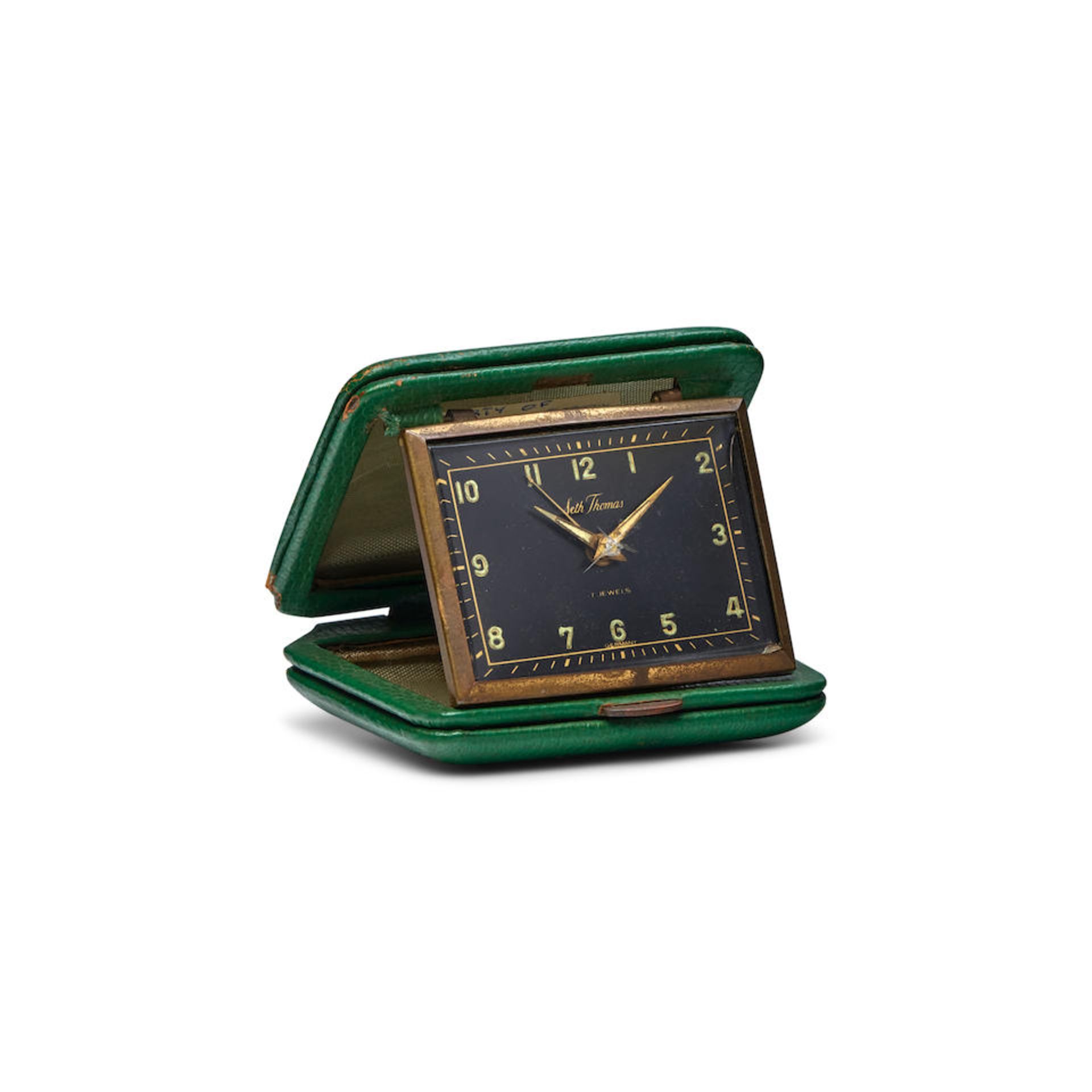 CORMAC MCCARTHY'S TRAVEL CLOCK. Folding Seth Thomas 7-jewel travel clock, manual wind,