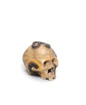 A CERAMIC OKIMONO (TABLE ORNAMENT) OF A SKULL AND SNAKE Taisho (1912-1926) or Showa (1926-1989) ...