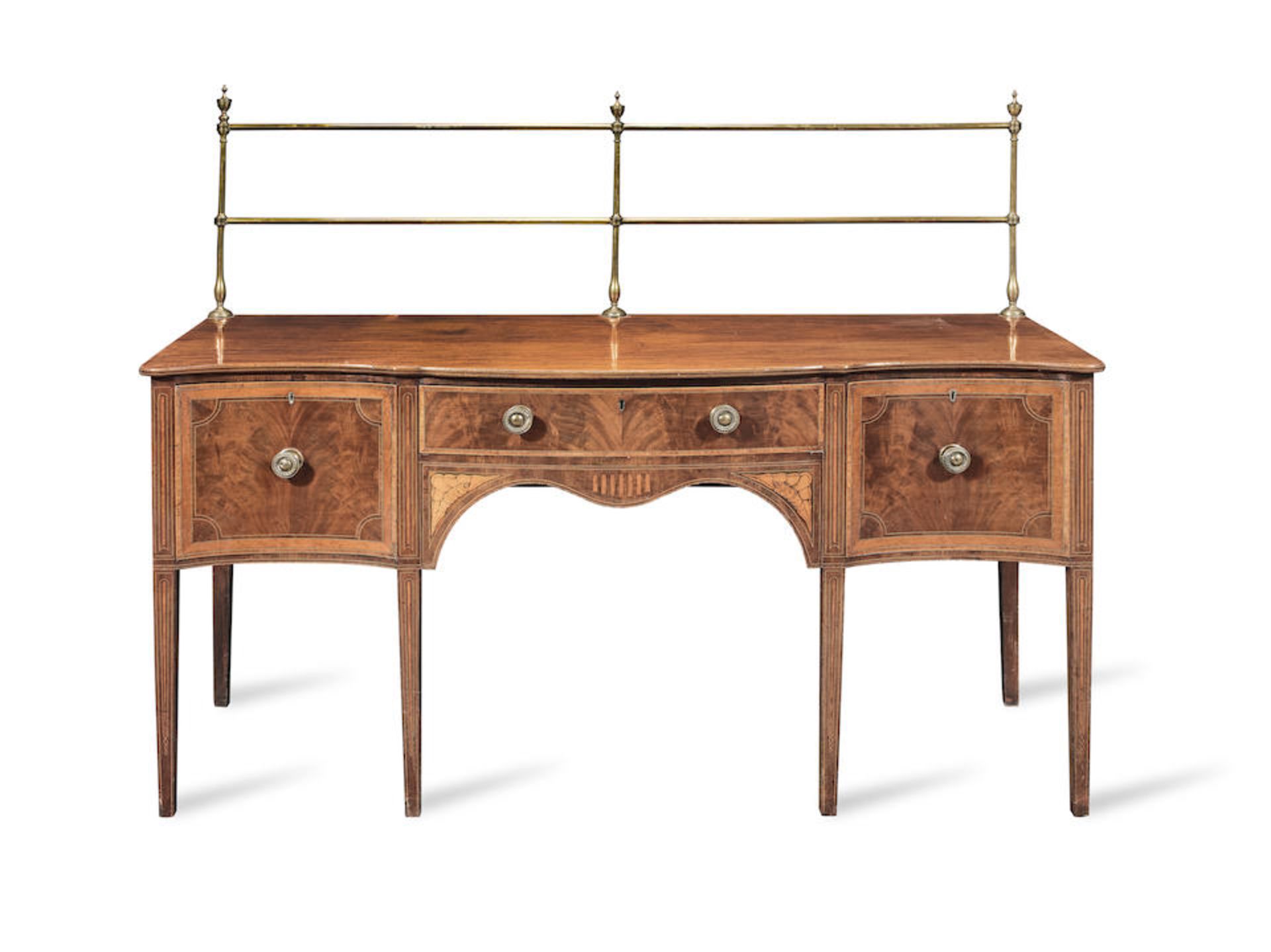 A George III mahogany, satinwood, tulipwood, purplewood and marquetry serpentine sideboard