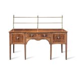 A George III mahogany, satinwood, tulipwood, purplewood and marquetry serpentine sideboard