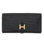 Hermès: a Shiny Black Porosus Crocodile Bearn Wallet 1980s