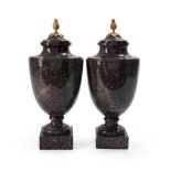 A Matched Pair of Gustavian Blyberg Porphyry Urns and Covers, Sweden, circa 1800.