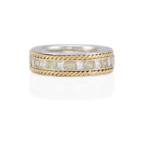 A PLATINUM, 18K GOLD AND DIAMOND BAND