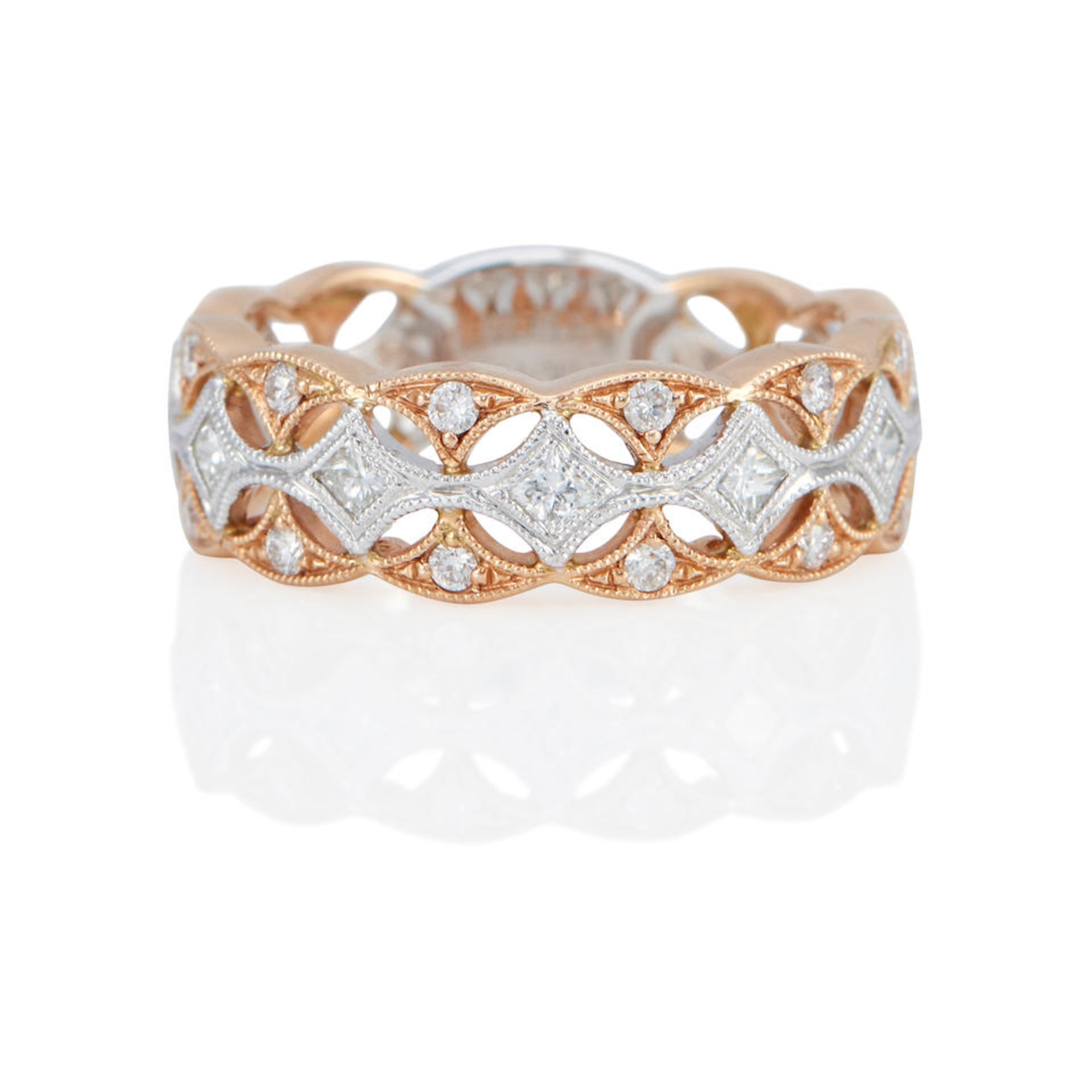 AN 18K BI-COLOR GOLD AND DIAMOND RING