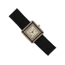 DRECIER & CO: AN ANTIQUE PLATINUM, 14K GOLD, DIAMOND, ONYX AND RIBBON WATCH