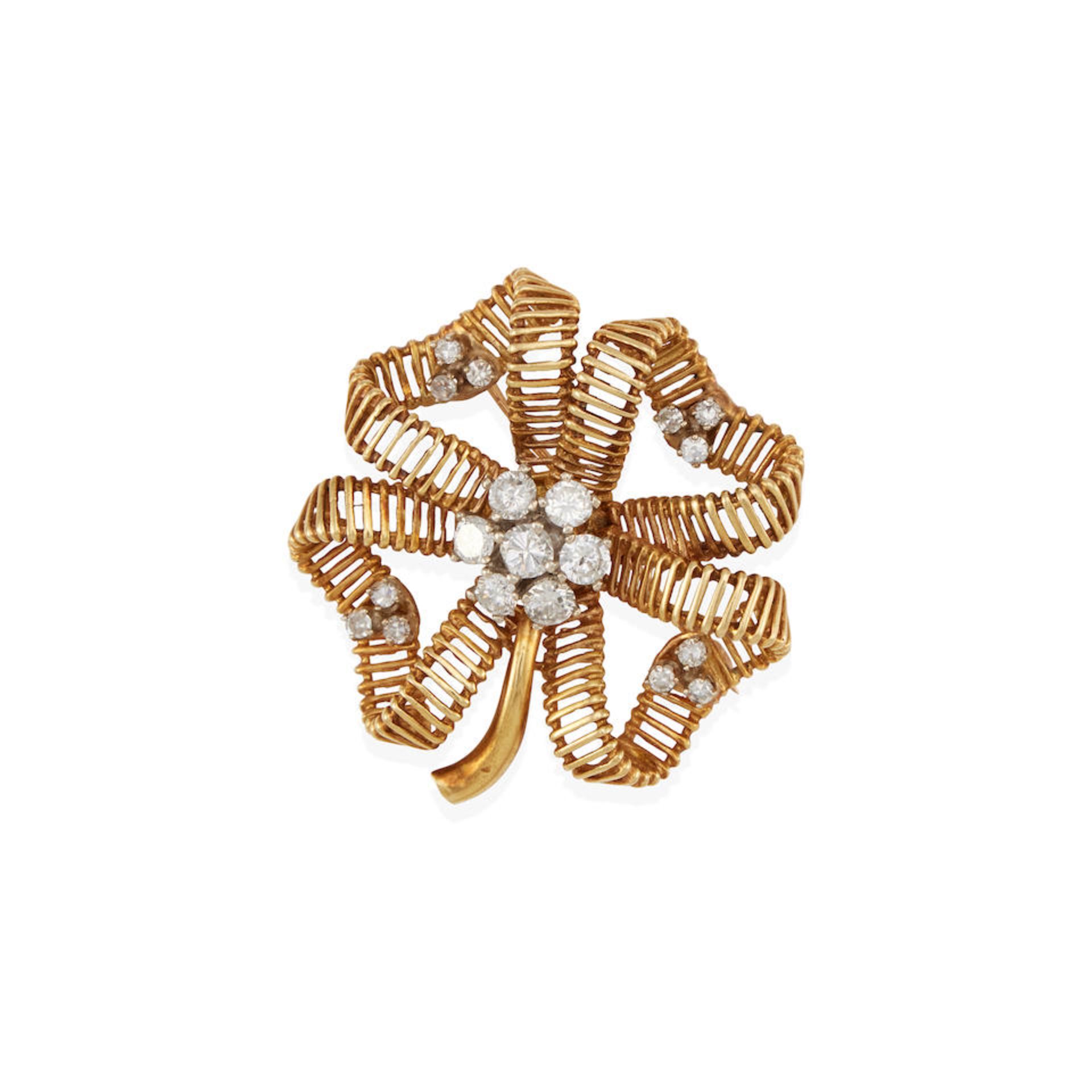 AN 18K GOLD AND DIAMOND FOUR LEAF CLOVER BROOCH