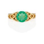 AN 18K GOLD AND EMERALD RING