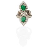 A 14K WHITE GOLD, EMERALD AND DIAMOND RING