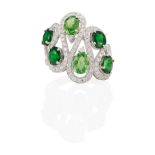 AN 18K WHITE GOLD, TSAVORITE GARNET AND DIAMOND RING