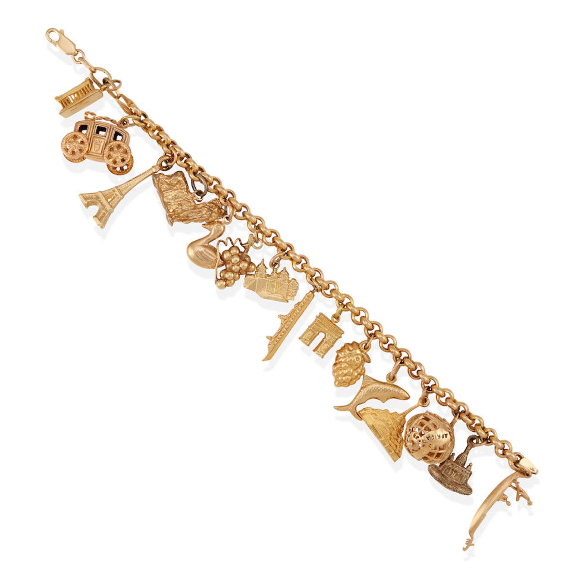 A GOLD AND METAL CHARM BRACELET