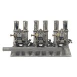 A triple set of replica Weber type 45 DCO3 carburettors mounted on a 0DEG inlet manifold,
