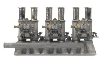 A triple set of replica Weber type 45 DCO3 carburettors mounted on a 0DEG inlet manifold,