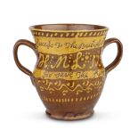 An English slipware pot, dated 1799