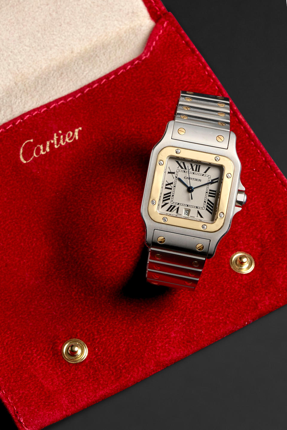 CARTIER. A STAINLESS STEEL AND 18K GOLD QUARTZ BRACELET WATCH Santos Galbée , Ref: 1566, c....